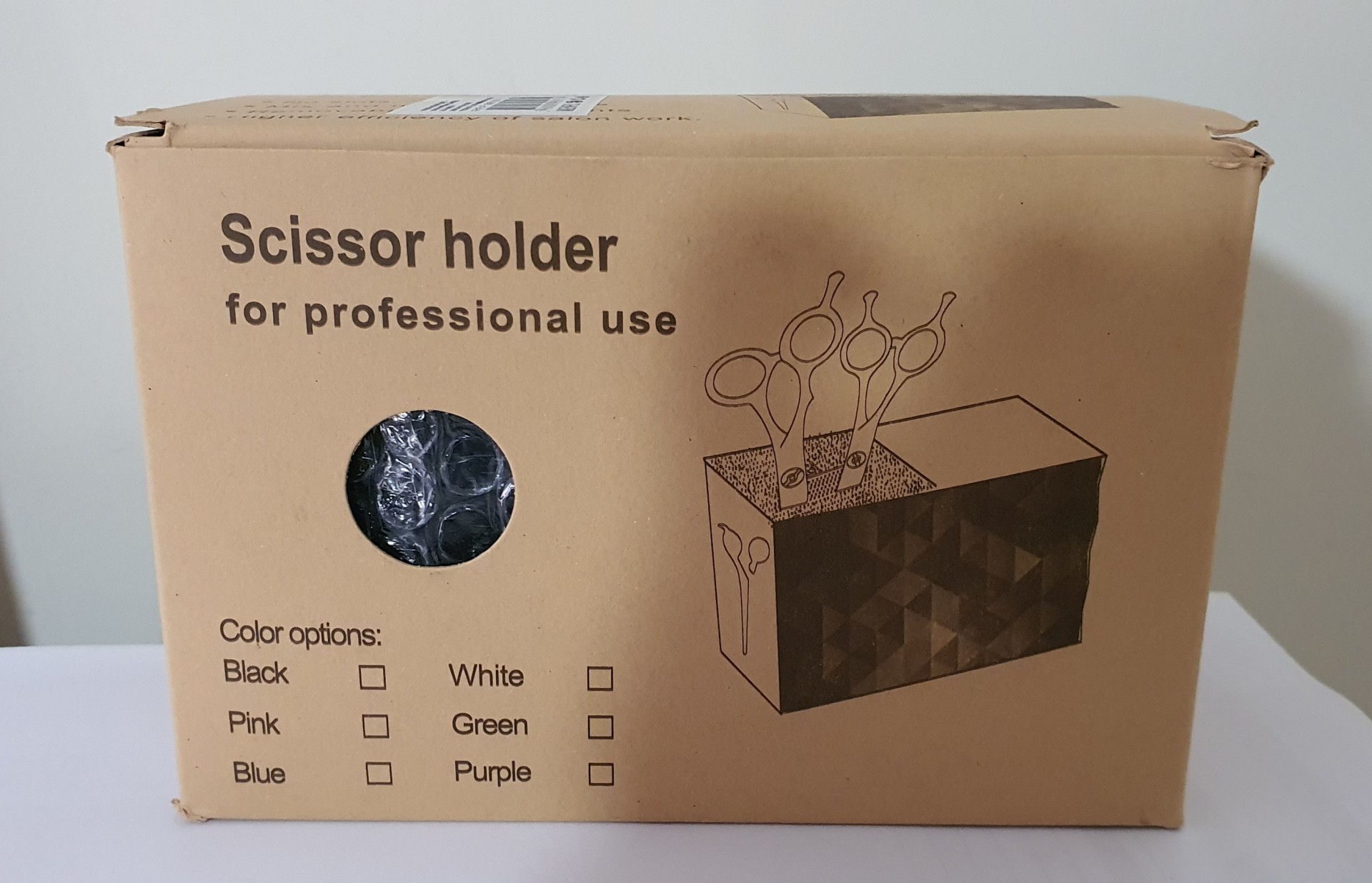 Caixa de cartão com suporte para tesouras ilustrado e texto em inglês