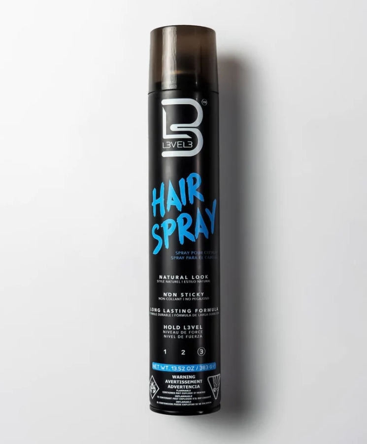 Spray de cabelo preto com texto azul e branco, tampa castanha translúcida