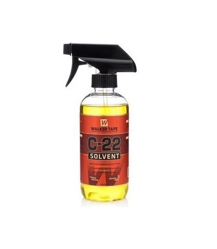 Frasco spray com líquido amarelo e etiqueta vermelha e preta