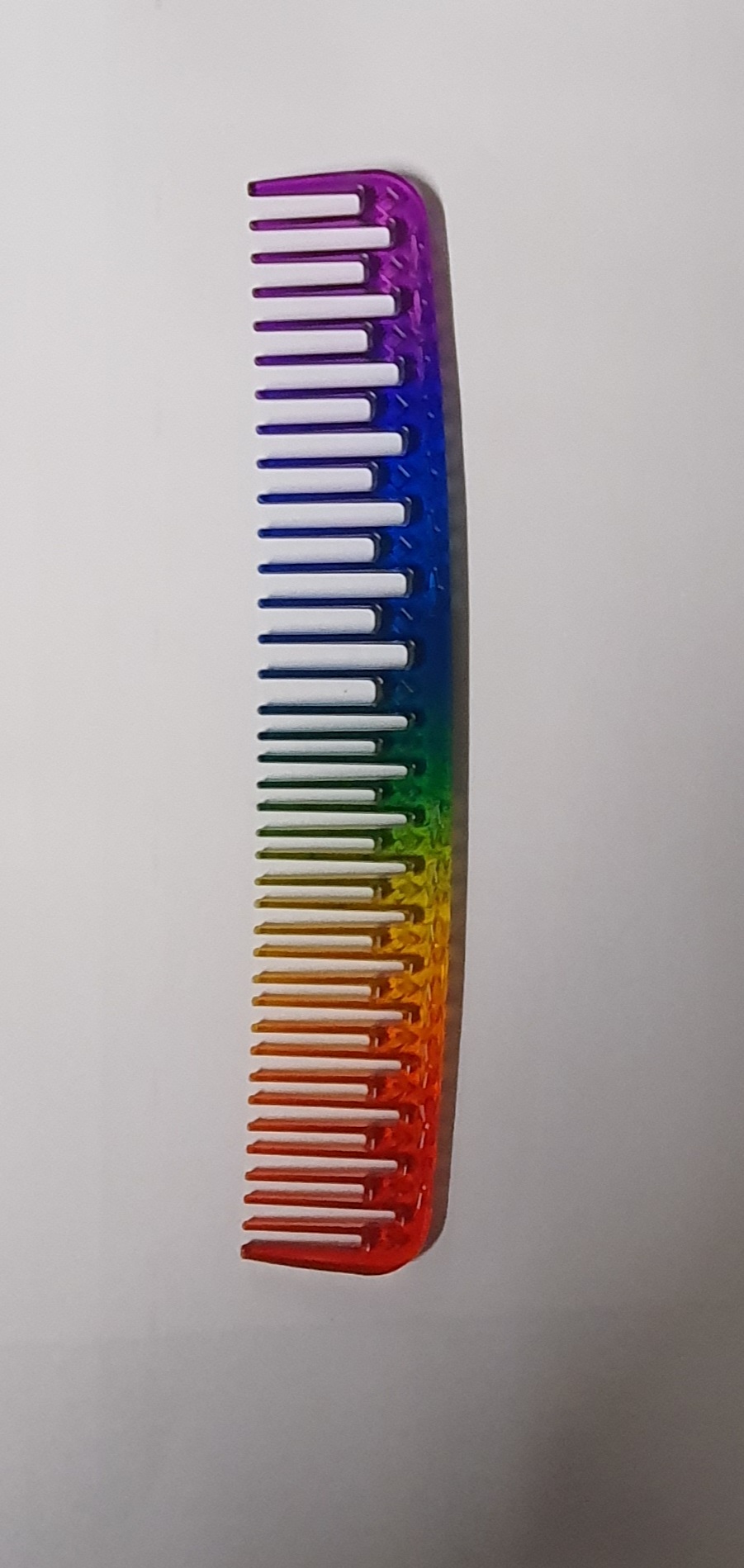 Pente plástico colorido com gradiente de cores