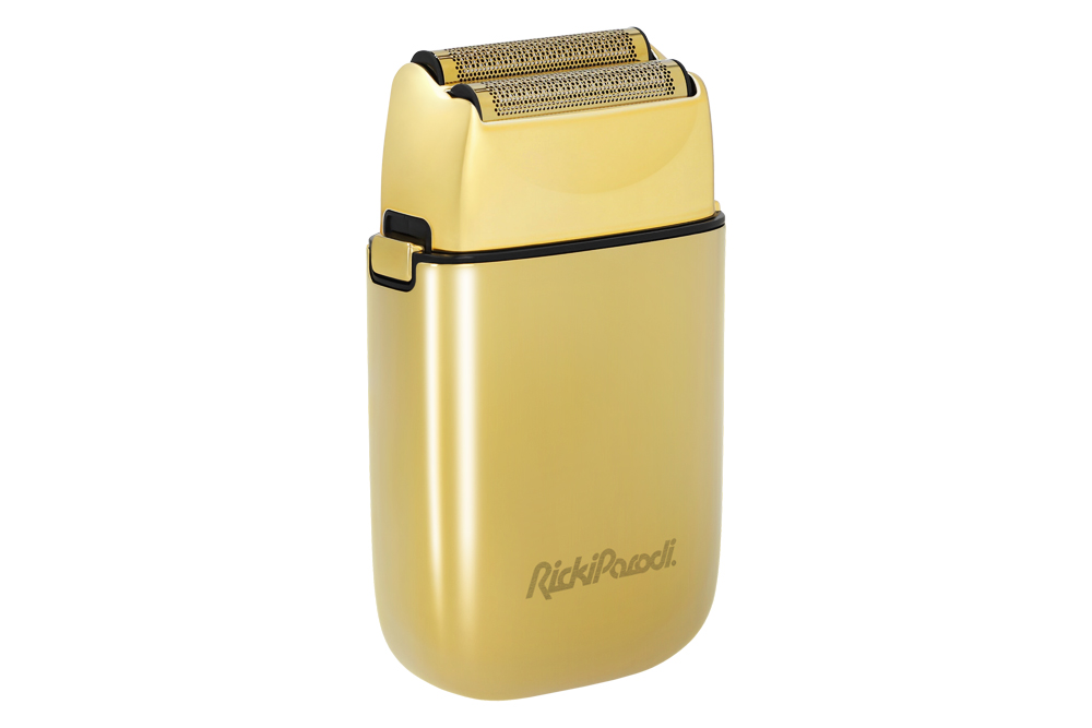 Aparelho de barbear elétrico dourado com duas lâminas e inscrição RickiParodi