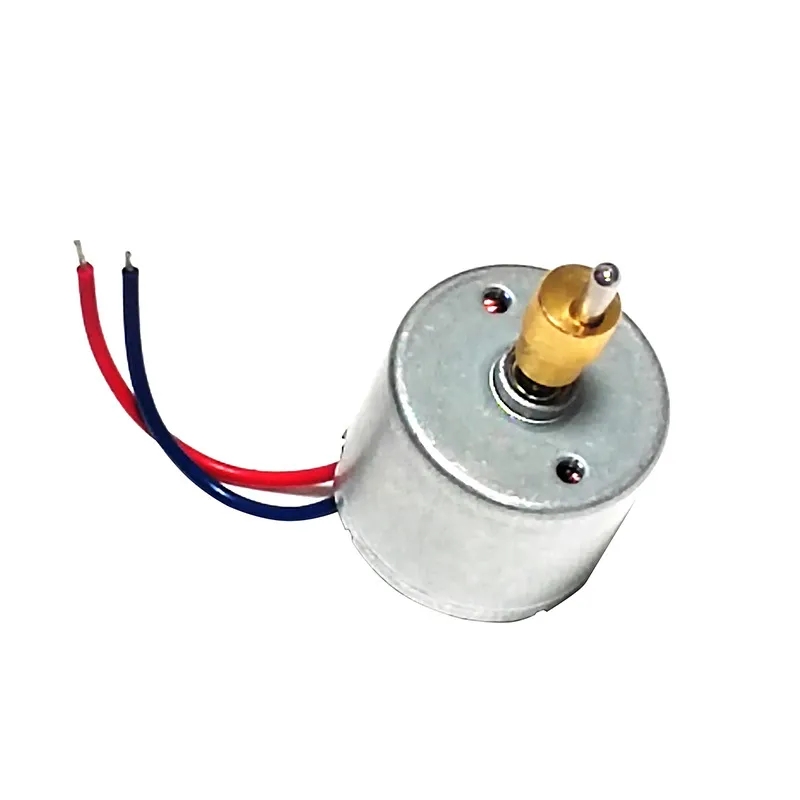Motor elétrico pequeno com eixo dourado e fios vermelhos e azuis