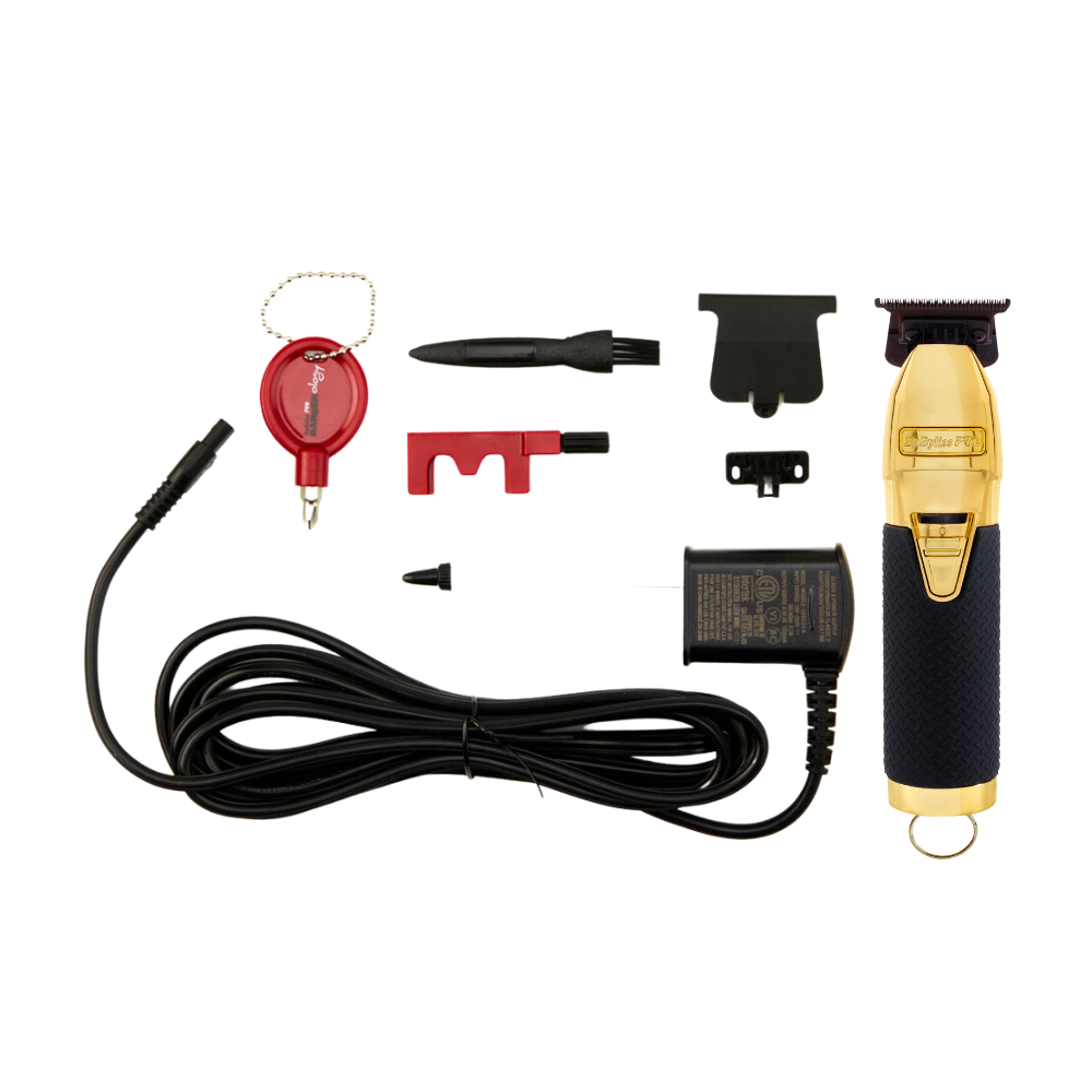 Máquina de cortar cabelo elétrica dourada e preta com acessórios diversos