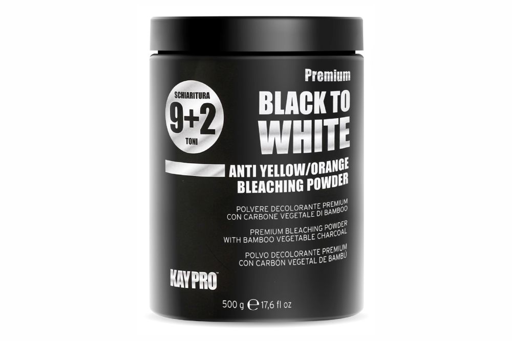 Frasco preto de pó branqueador para cabelo com texto branco e prateado