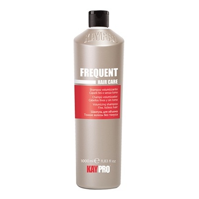 Frasco de plástico cinzento para cuidado do cabelo da marca KAY PRO com etiqueta vermelha e branca