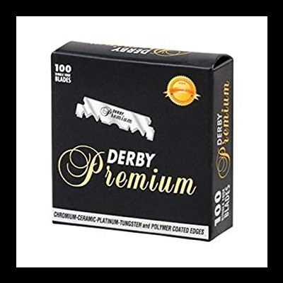Embalagem preta de lâminas de barbear Derby Premium com texto dourado e branco