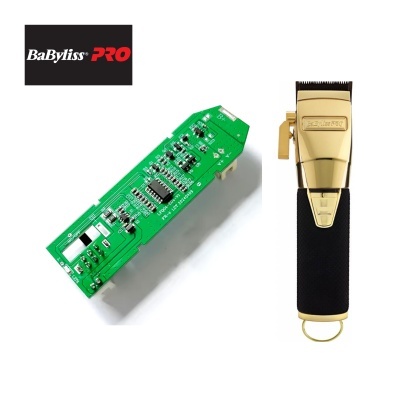 Máquina de cortar cabelo BaByliss PRO dourada com placa eletrónica verde