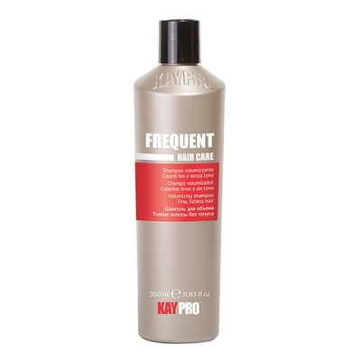 Frasco prateado de produto de cuidado capilar KAY PRO com rótulo vermelho.