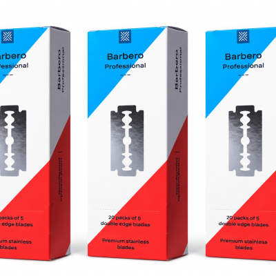 Caixas de lâminas de barbear Barbero Professional com design azul, branco e vermelho e texto preto.