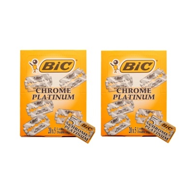 Dois pacotes amarelos de lâminas de barbear BIC Chrome Platinum com pequenas caixas de lâminas diante deles