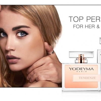 Casal próximo de dois frascos de perfume YODEYMA, TENDENZE e PELLA, e texto promocional em fundo branco