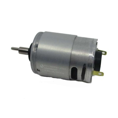 Motor elétrico metálico prateado com eixo e terminais elétricos