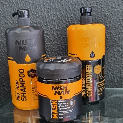 Produtos Nish Man para cabelo: shampoo, condicionador e máscara em tons amarelo, preto e cinza