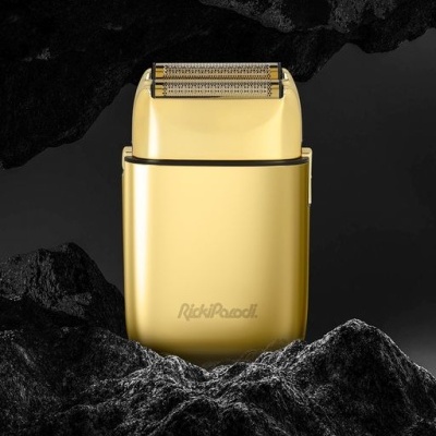 Aparelho de barbear elétrico dourado com grelha metálica