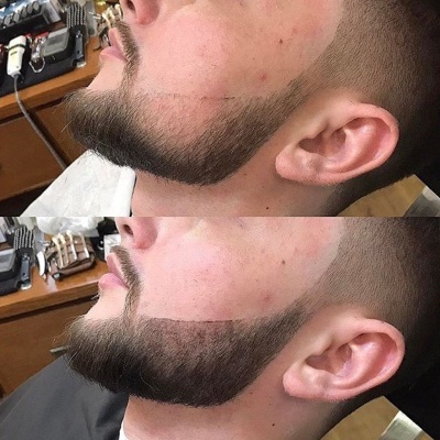 Perfil masculino com corte de cabelo curto e barba bem aparada e definida