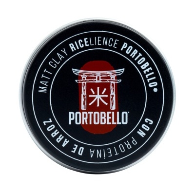 Lata preta de matt clay Portobello com texto branco e logo vermelho e branco