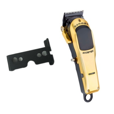 Máquina de cortar cabelo dourada e acessório preto