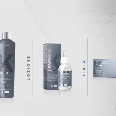 Produtos capilares cinza escuros KAYPROXIL SCALP DARK shampoo, lozione e fiala em fundo claro
