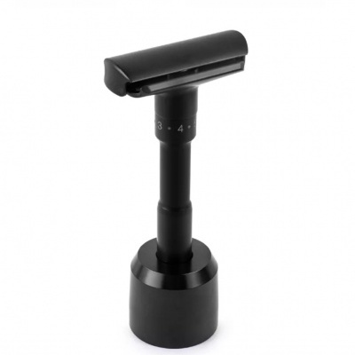 Aparelho de barbear preto com suporte