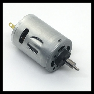 Motor elétrico metálico pequeno com eixo frontal e conexões traseiras