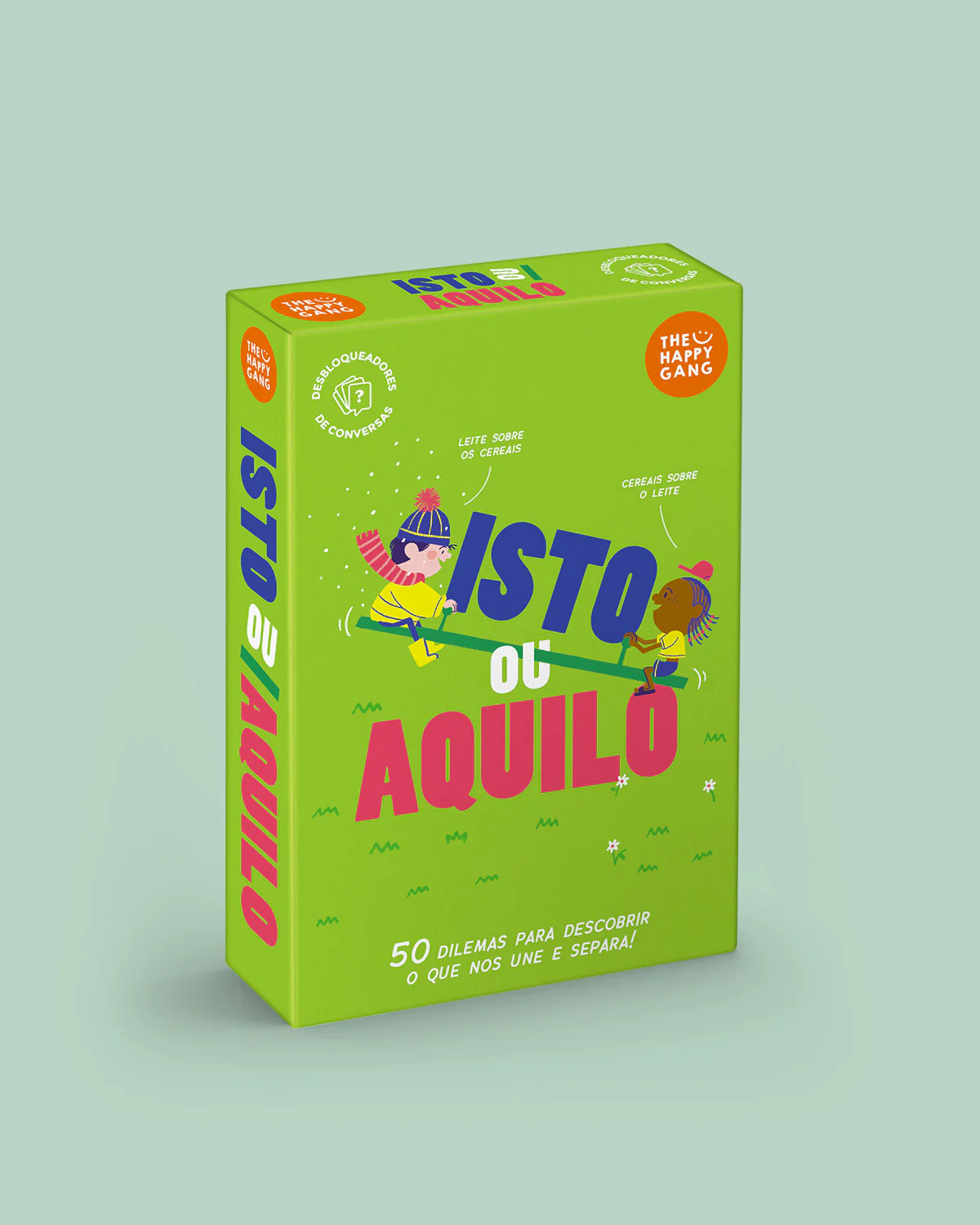 Embalagem verde de um jogo de cartas ISTO ou AQUILO com ilustrações e texto em português.