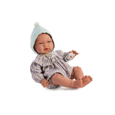 Boneca bebé com roupa floral e gorro azul