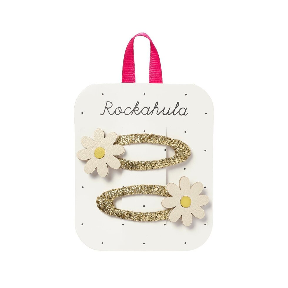 Ganchos de cabelo dourados com flores em cartão branco da marca Rockahula