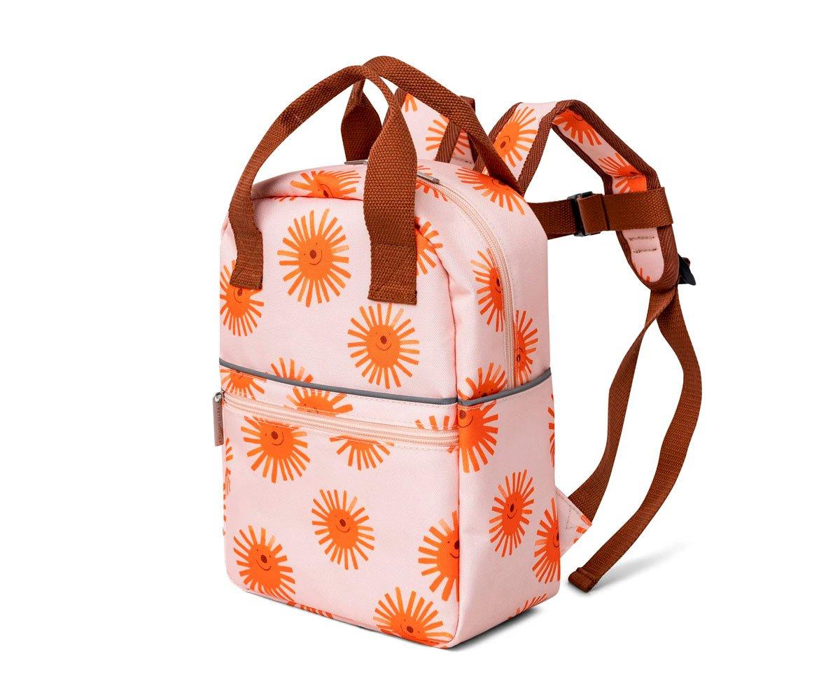 Mochila rosa claro com flores laranja e alças castanhas