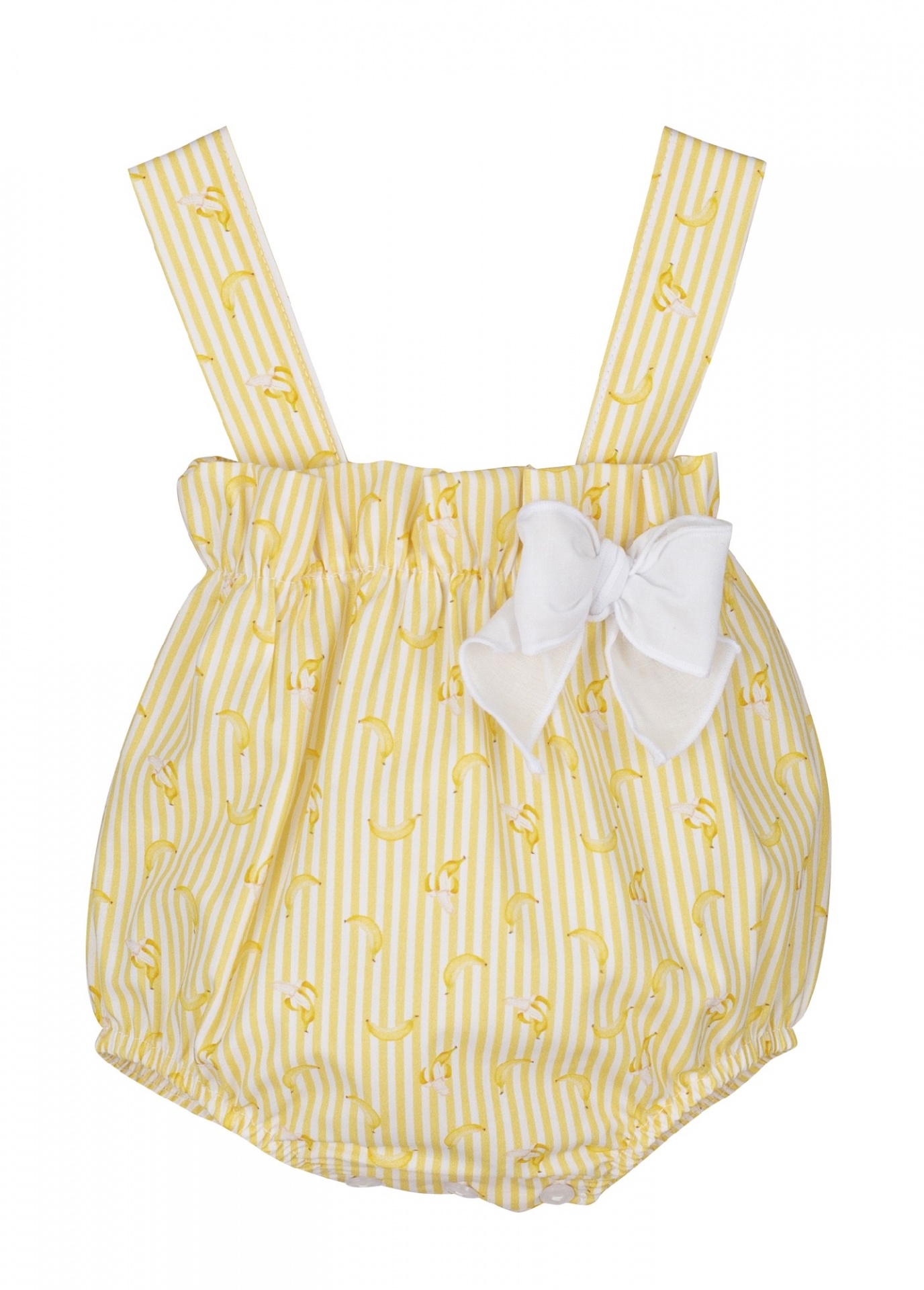Jardineira de bebé amarela com riscas brancas e padrão de bananas, com laço branco na frente.