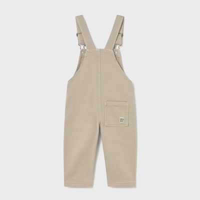 Jardineira bege para criança com bolso frontal e alças ajustáveis