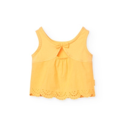 Top amarelo claro para criança com laço e detalhe perfurado na bainha