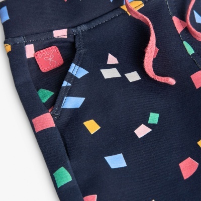 Calças de fato de treino azul escuro com padrão colorido e cordão rosa