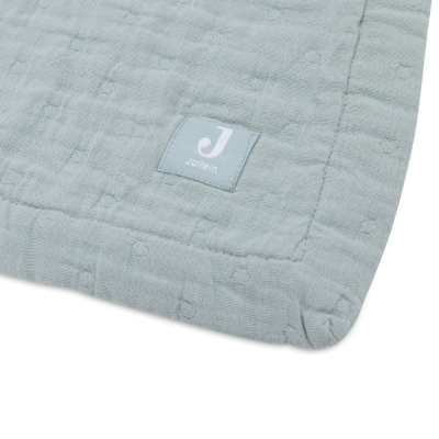 Pano azul claro com textura e etiqueta Jollein