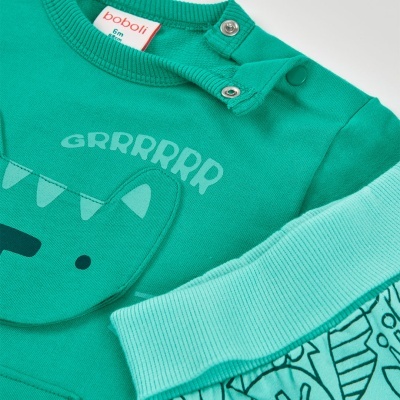 Roupa de bebé verde com estampa de dinossauro e texto Grrrrr, botões no ombro, etiqueta boboli 6m