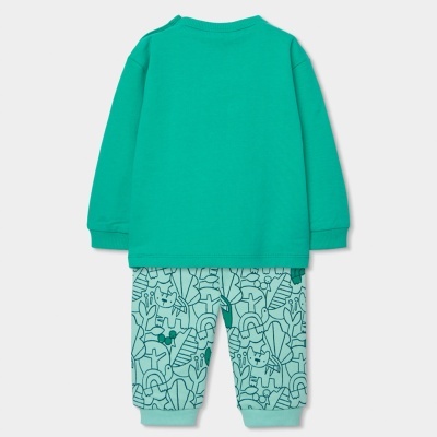 Conjunto infantil com camisola verde turquesa e calças estampadas em azul claro e verde.