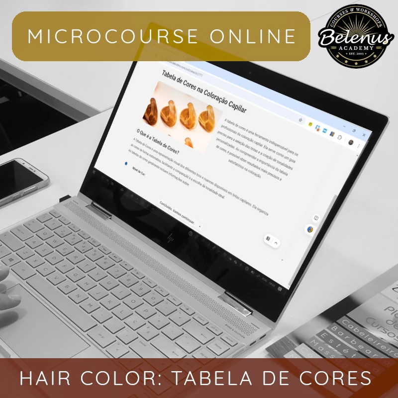 Microcurso Online: Tabela de Cores na Coloração Capilar Computador portátil com página sobre coloração capilar e amostras de cores em cabelo