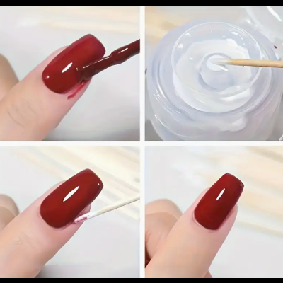 Unhas artificiais vermelhas sendo pintadas e verniz transparente aplicado