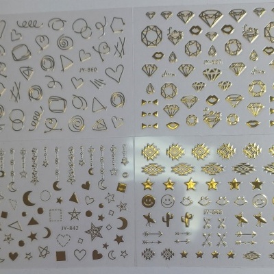 Folhas de autocolantes dourados para unhas com diversos desenhos