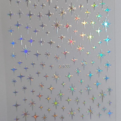 Folha com autocolantes holográficos de estrelas coloridas