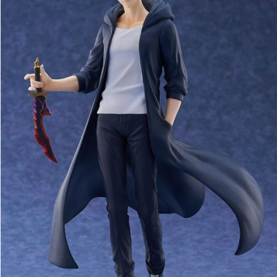 Figurine of young male character in dark coat holding red and black sword