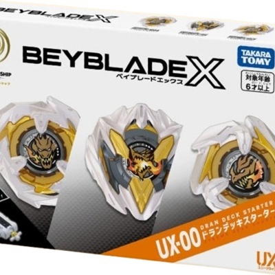 Caixa do brinquedo Beyblade X UX-00 com peças brancas, douradas e cinza