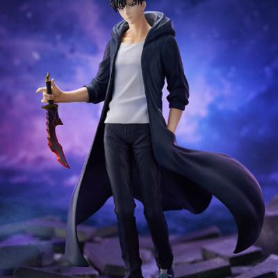Figurine of male character with black coat holding red and black sword on broken ground base