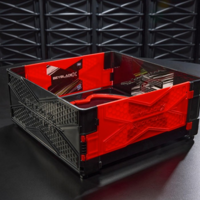 Beyblade X-ATREX black and red plastic battle arena with embossed text on a black patterned surface