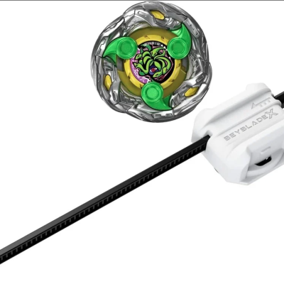Beyblade toy with green dragon design and white Beyblade X launcher
