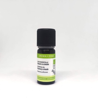 Frasco de óleo essencial de alecrim em vidro escuro com rótulo branco e verde