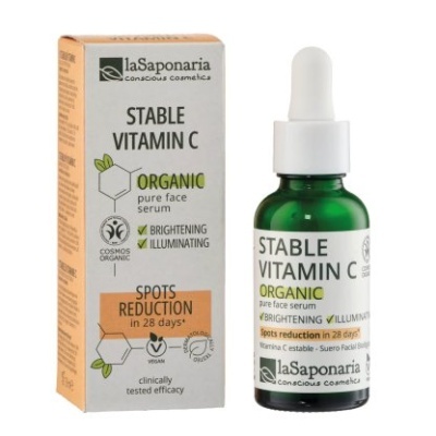 Frasco de serum facial e caixa da laSaponaria com texto sobre vitamina C orgânica e redução de manchas