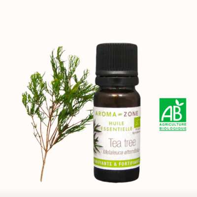 Frasco de óleo essencial Tea tree com ramo da planta e símbolo Agricultura Biológica