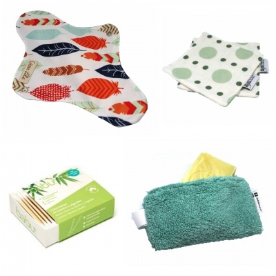 Conjunto de acessórios têxteis com padrões coloridos e embalagem verde e branca