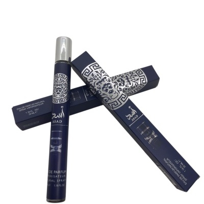 Frasco e caixa de perfume azul escuro com decoração prateada e texto ASAD