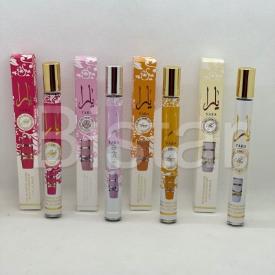 Frascos de perfume YARA em cores rosa, lilás, laranja e creme com caixas
